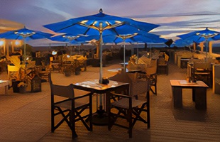 Create Ambiance for Outdoor Dining After Dark with Fiberbuilt's LED Light Kit for umbrellas.