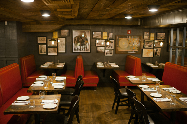 Red booths pop against a warm backdrop at Park Restaurant