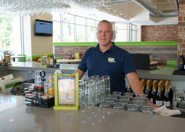 bp Chris Milton Behind Counter