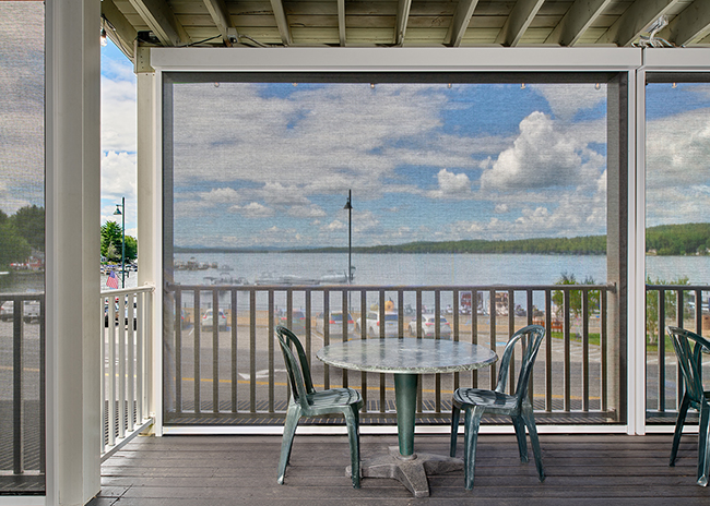 FlexShade ZIP with Phifer SunTex 95 5% Black fabric, installed at Rick’s Café, Naples, Maine. Dealer & Installer: Futureguard. Photographer: Blind Dog Photo Associates.