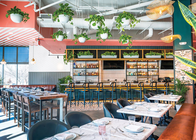 Wood and stone tabletops, as depicted here at Makers Union Pub in Washington, D.C., convey a more natural, authentic experience than laminates, says Jason Maringola, with ZDS Architecture  & Interiors. Image courtesy of ZDS Architecture & Interiors.