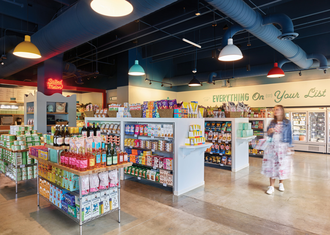 The front part of the large, open space along an expansive wall of windows is dedicated to the retail market and lounge seating area. Images courtesy of Chris Edwards