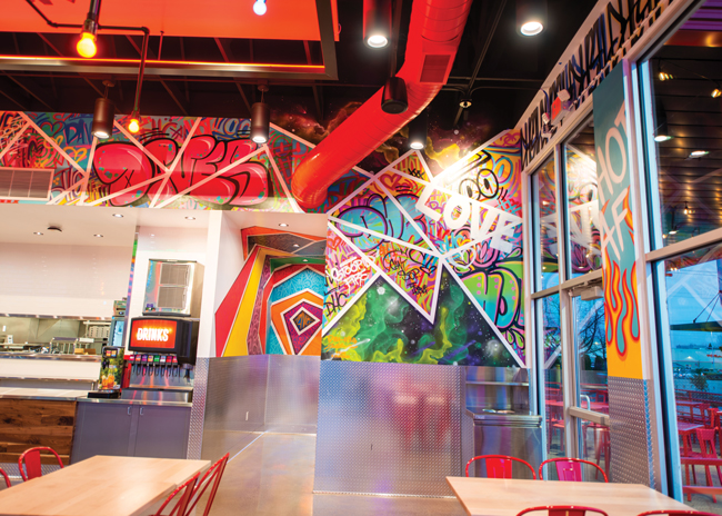 Ducts painted a vibrant red add punch to the open ceiling design at this Dave’s Hot Chicken site. Images courtesy Dave’s Hot Chicken