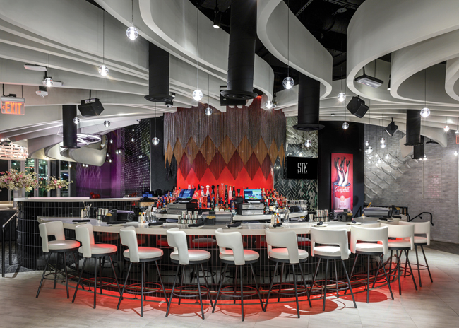 Using high-quality and interesting materials around the bar sets the tone like at Mastros Miami, designed by DP3 Architects. Image courtesy of Roberto Ferren