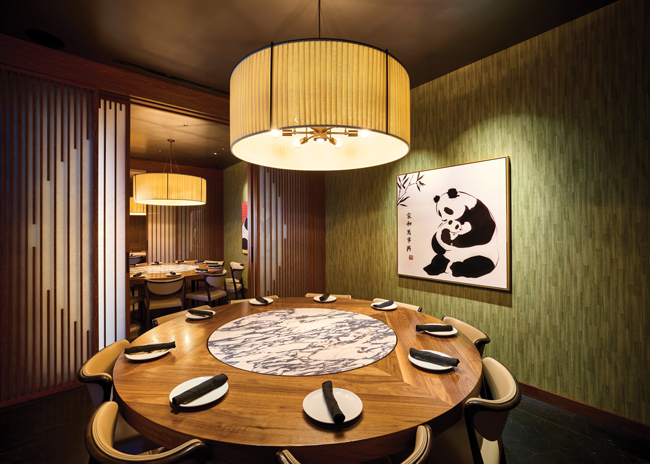 The private dining rooms at Panda Inn’s flagship feature wallpaper reminiscent of Chinese greenery, while the circular pattern on sliding doors evokes the moon, a symbol of gatherings in many Asian cultures.